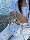 Louis Vuitton's Street Bomber of the Year! White background colorful flowers instantly light up when wearing a second-hand fashion bag