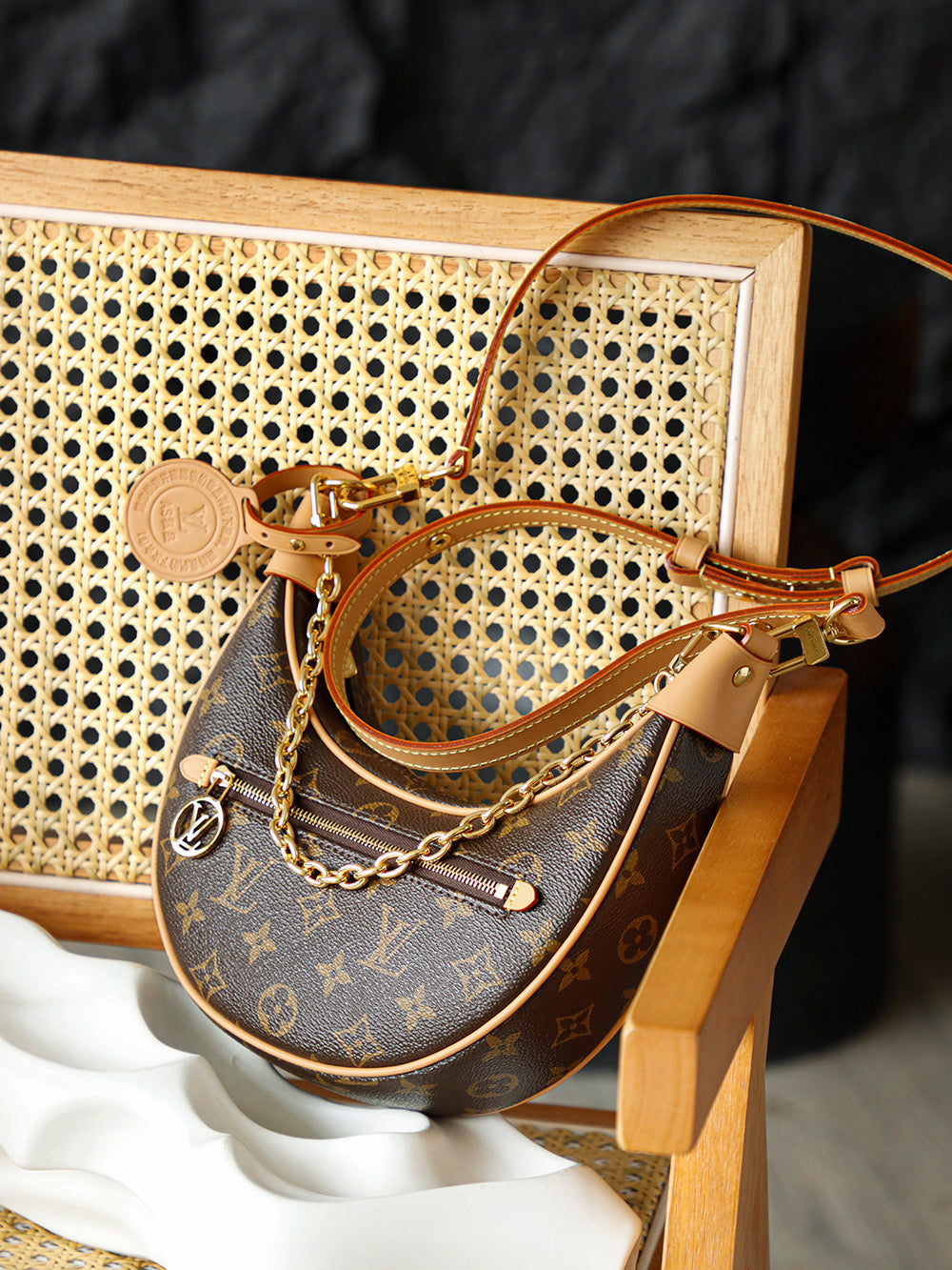 Used LV luxury handbag versatile for commuting, dirt resistant, crescent shaped silhouette design