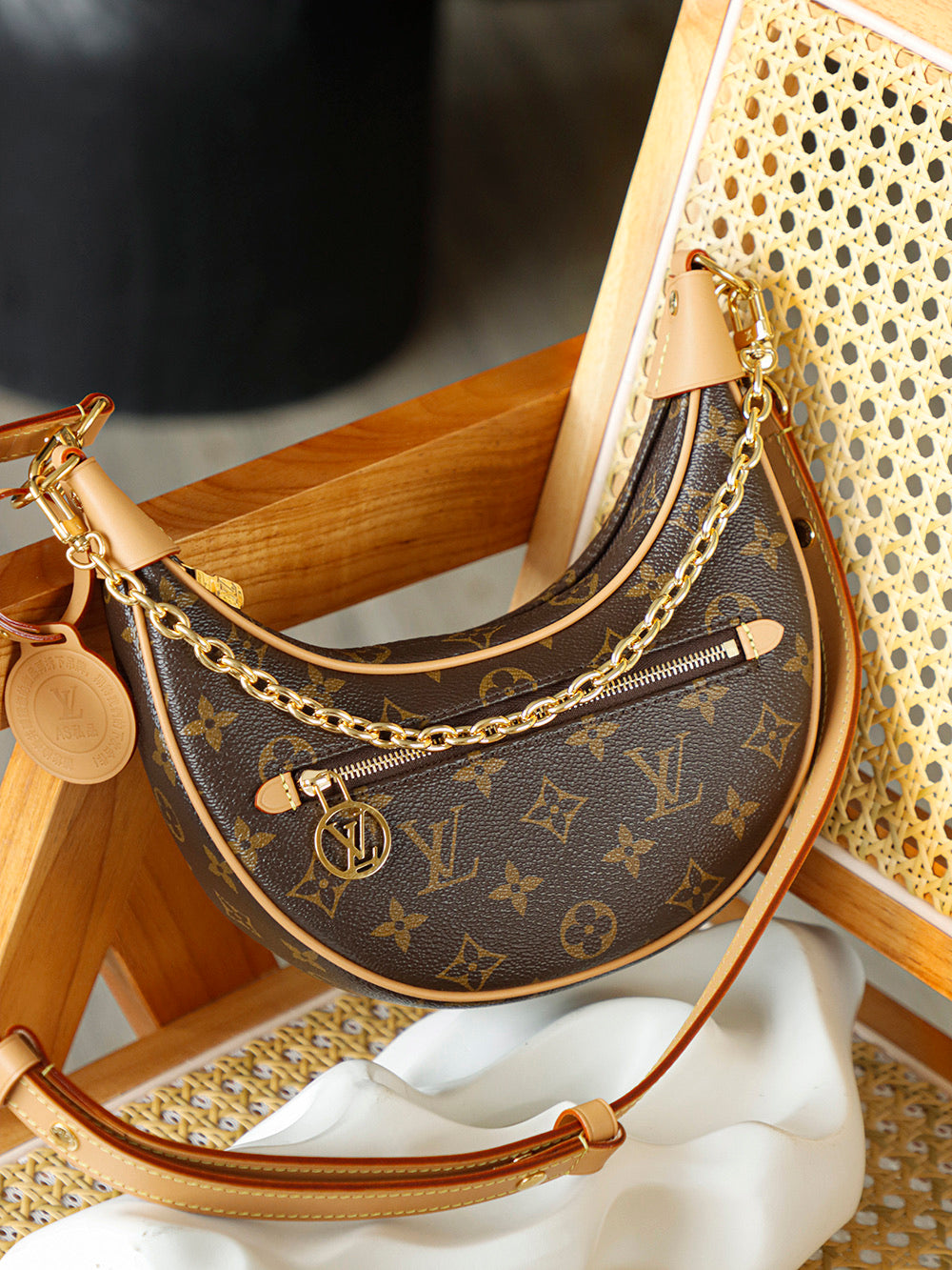 Used LV luxury handbag versatile for commuting, dirt resistant, crescent shaped silhouette design