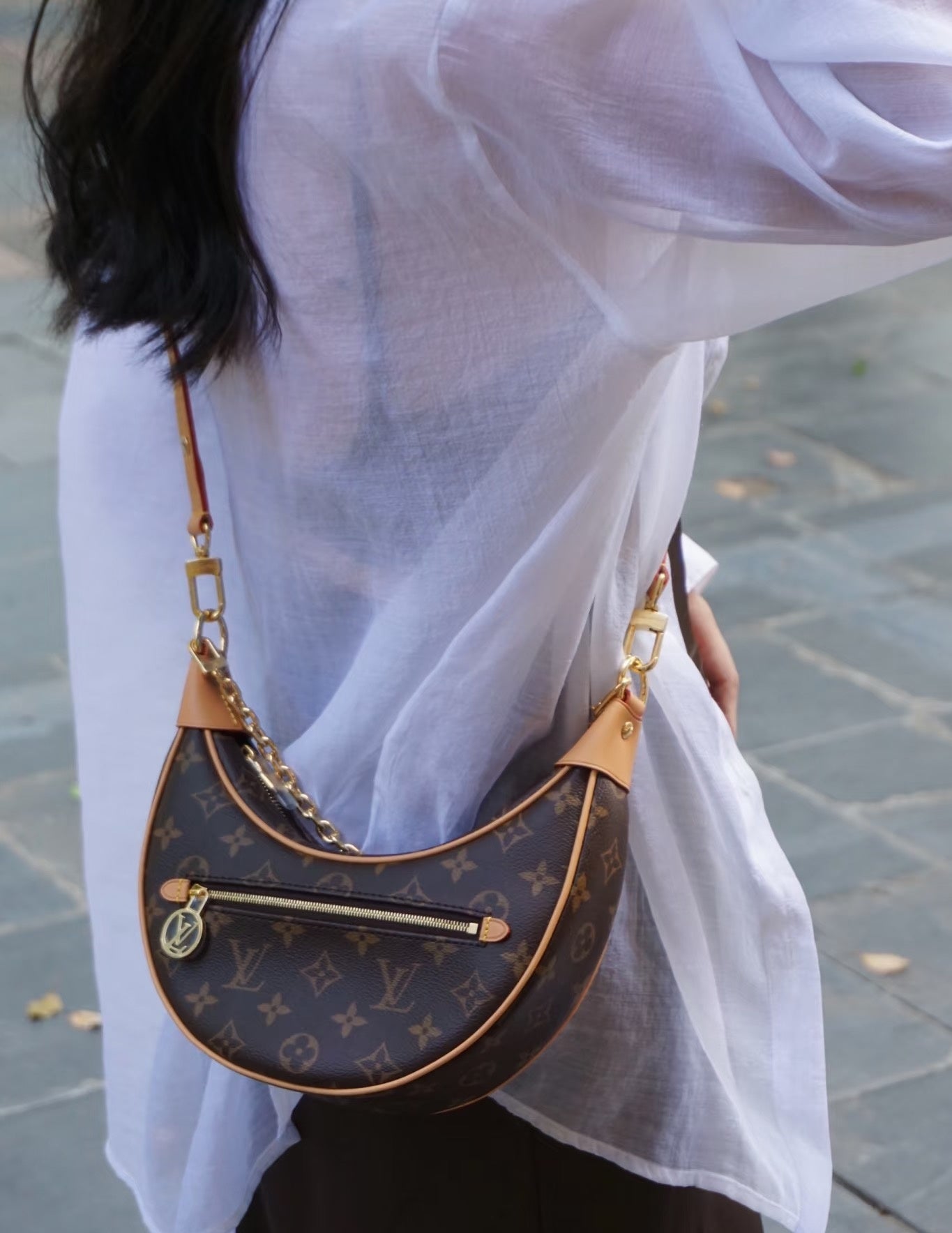 Used LV luxury handbag versatile for commuting, dirt resistant, crescent shaped silhouette design