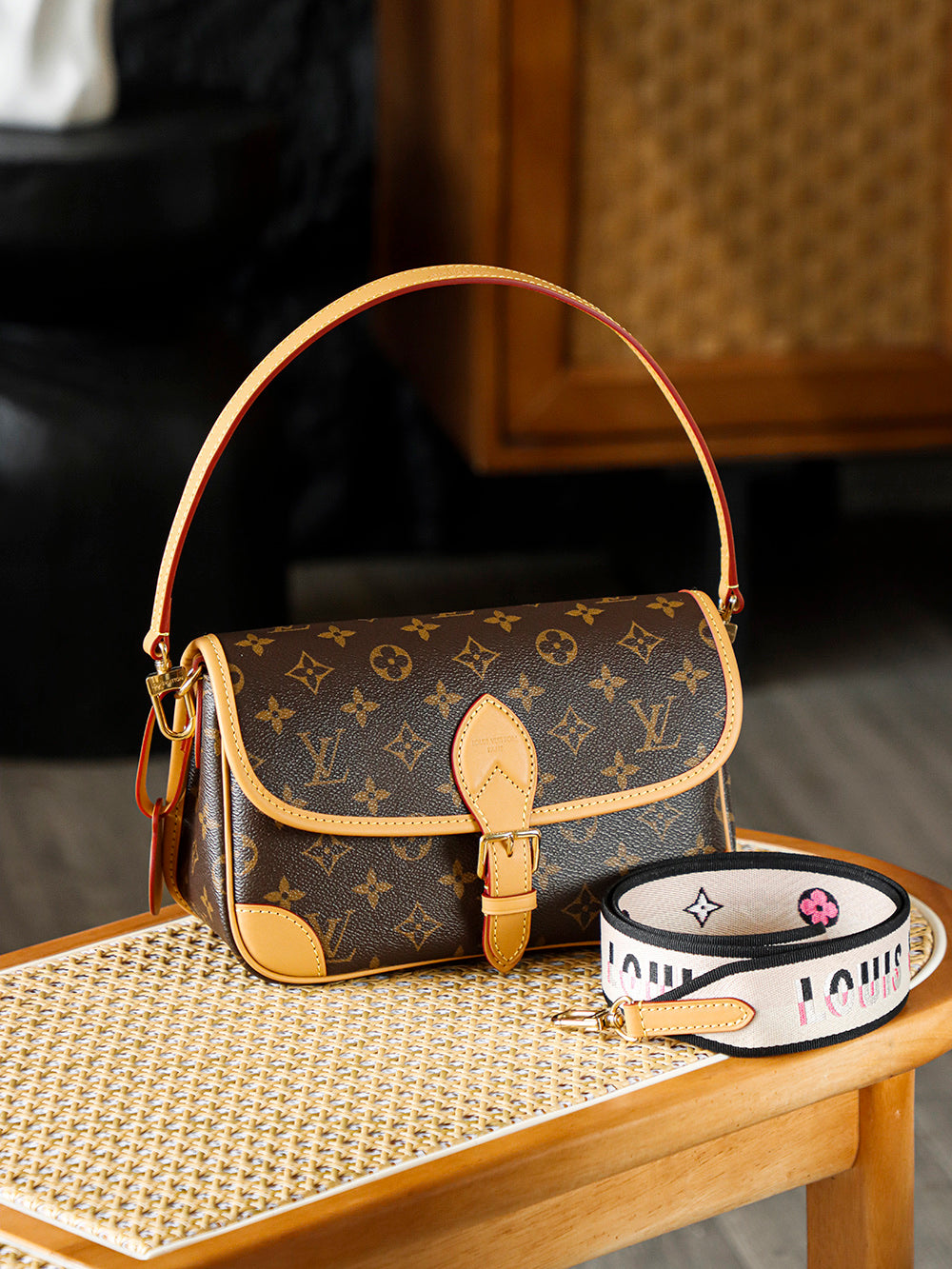 Second hand Louis Vuitton luxury bag with baguette bag featuring a simple yet unique jacquard wide shoulder strap design