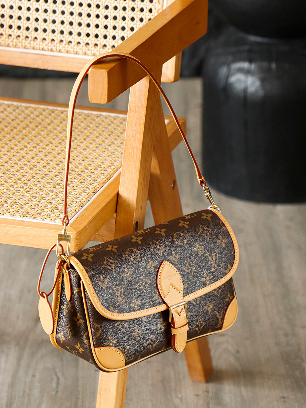 Second hand Louis Vuitton luxury bag with baguette bag featuring a simple yet unique jacquard wide shoulder strap design