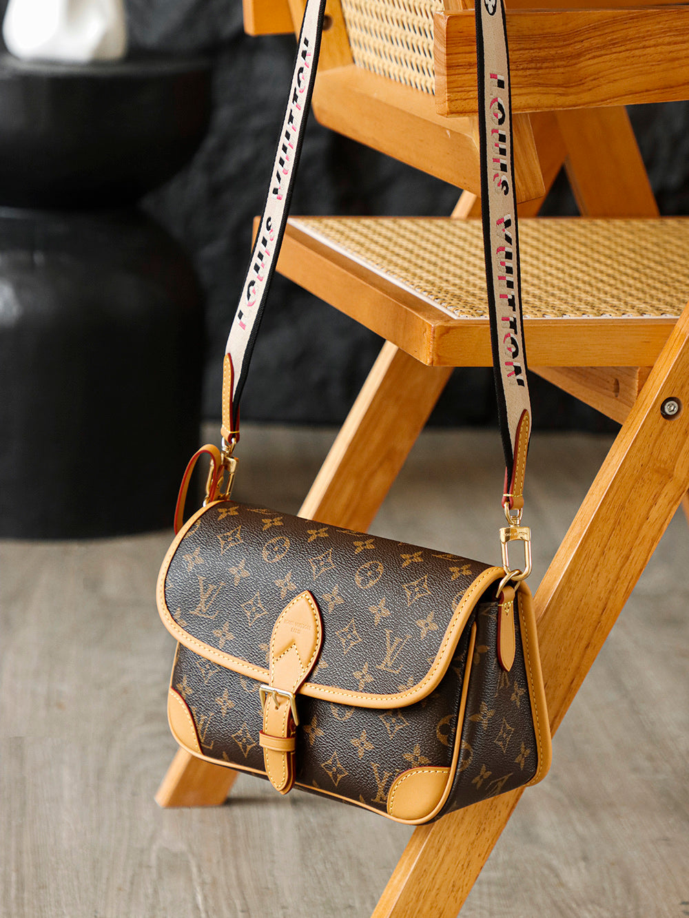 Second hand Louis Vuitton luxury bag with baguette bag featuring a simple yet unique jacquard wide shoulder strap design